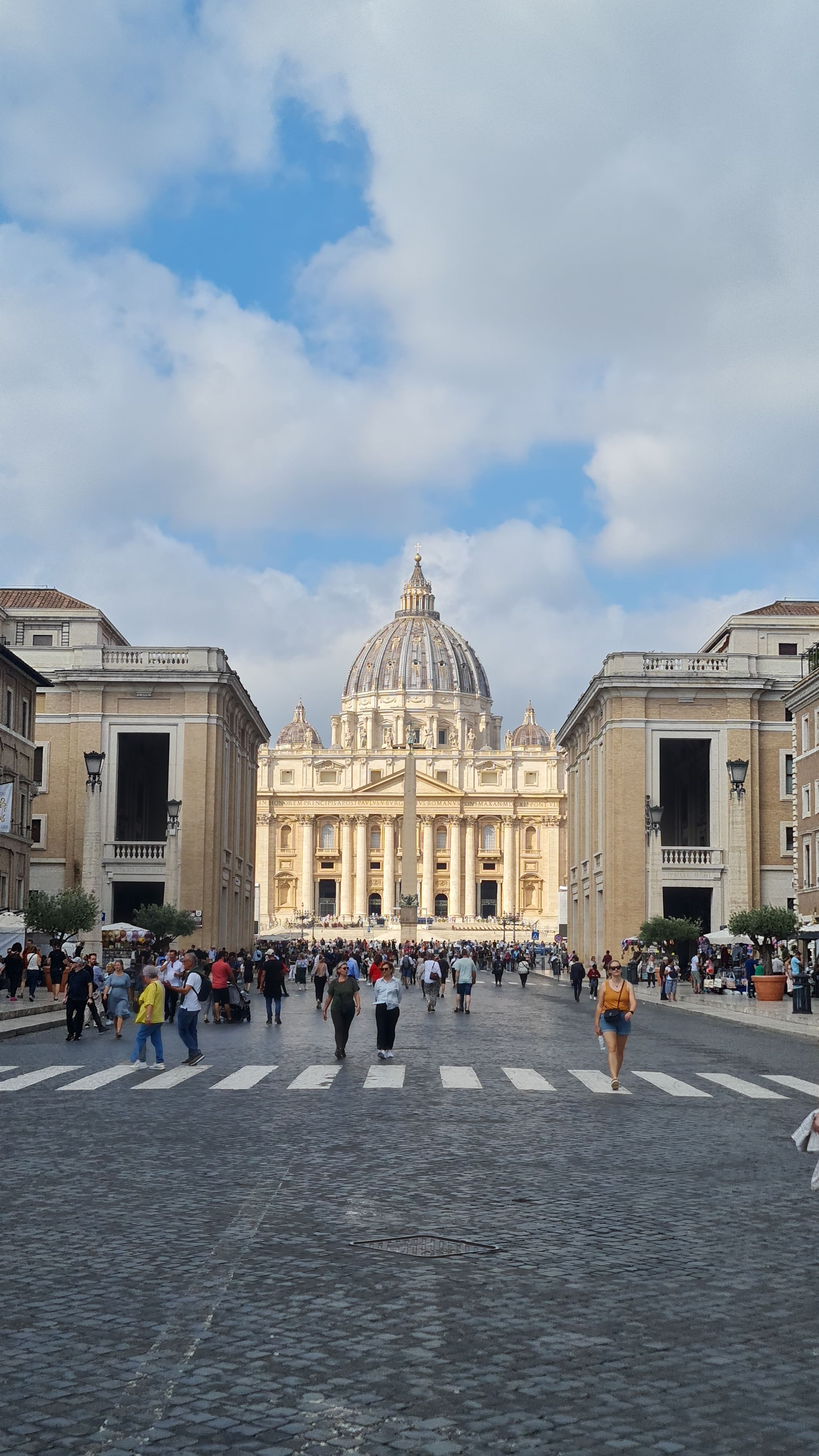 St. Peter's Basilica at the end of Via della Conciliazione under a cloudy sky, Rome