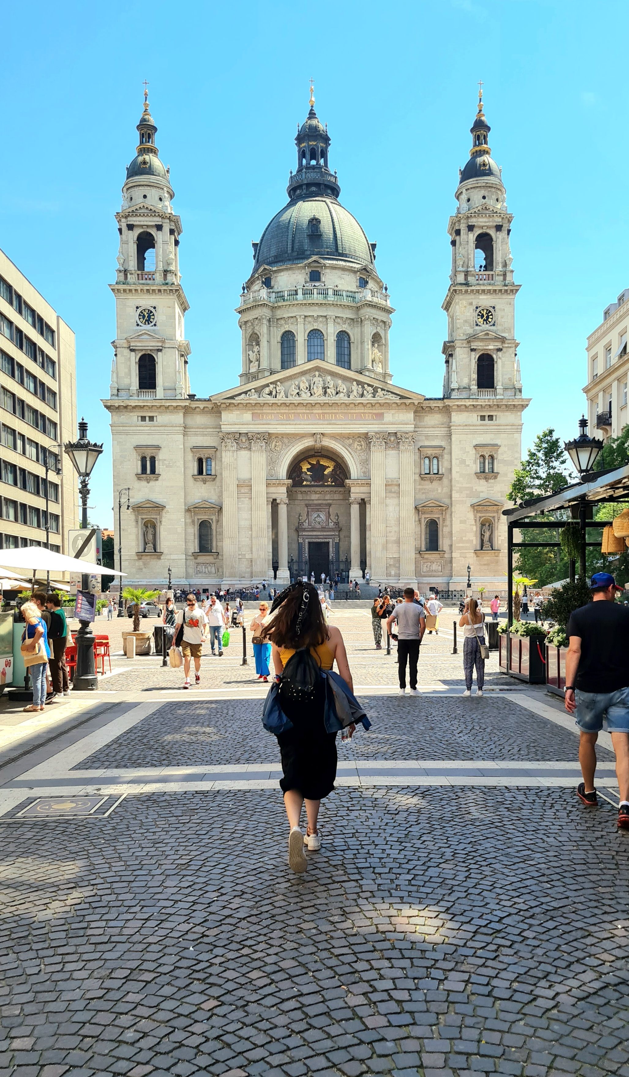 A woman walking toward St. Stephen's Basilica, Budapest